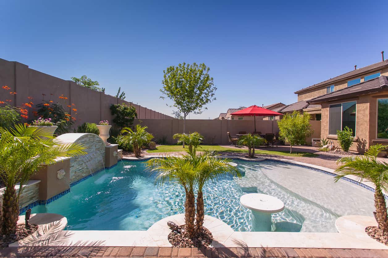 Modern Resort Pool with Travertine Deck in Arcadia